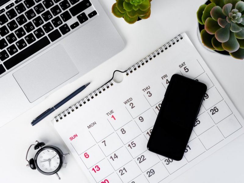 Calendar page close up on wooden office desk